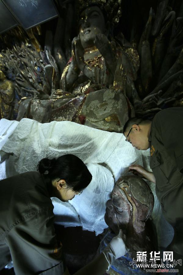 #（文化）（4）持續(xù)陰雨阻礙重慶大足千手觀音造像修復工作