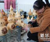 葫蘆烙畫迎羊年 圖