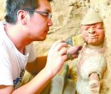 山西大同發(fā)現(xiàn)北魏石槨墓 出土彩陶隨葬品